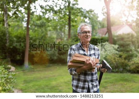 Similar – Image, Stock Photo Senior man cutting logs, working in the garden