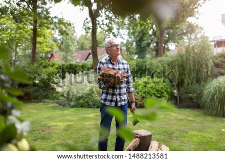 Similar – Image, Stock Photo Senior man cutting logs, working in the garden