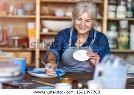 Similar – Image, Stock Photo Senior craftswoman in art studio