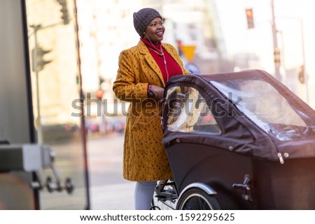 Similar – Image, Stock Photo Woman using cargo bike in urban area