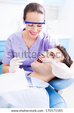 Female dentist and patient in dentist office