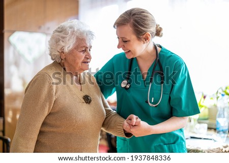 Similar – Image, Stock Photo Home caregiver helping senior woman with medication