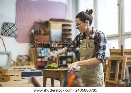 Similar – Image, Stock Photo Artisan woman working with torch on jewels