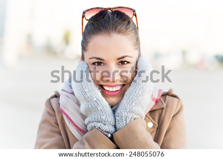 Beautiful woman in mittens