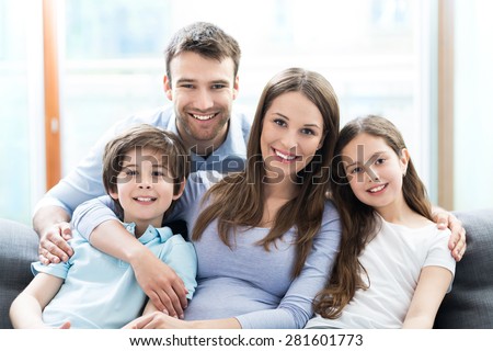 Family sitting on couch