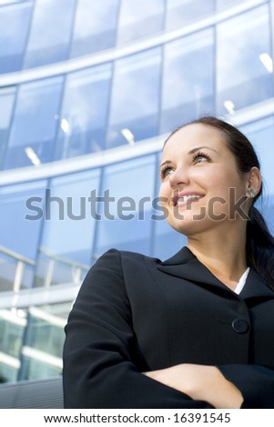 Businesswoman outside a modern office building