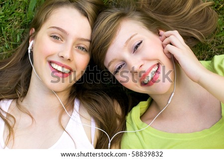 Image, Stock Photo Two young girls listening to good music while driving in car, enjoy summer road trip in nature.