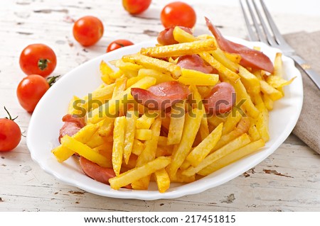 Fried potatoes with sausage on a plate
