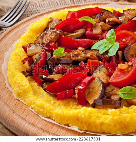 Polenta with vegetables - corn grits pizza with tomato and eggplant