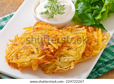 Fragrant potato pancakes with sour cream and herbs