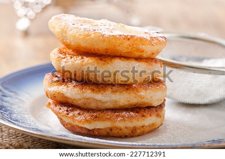 Cottage cheese pancakes sprinkled with powdered sugar