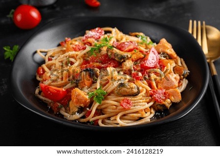 Similar – Image, Stock Photo Traditional pasta with seafood. The chef prepares a pasta marinara. The chef decorates the dish with tweezers. Spaghetti with seafood. Mediterranean Kitchen. People at work. Close-up. Body parts