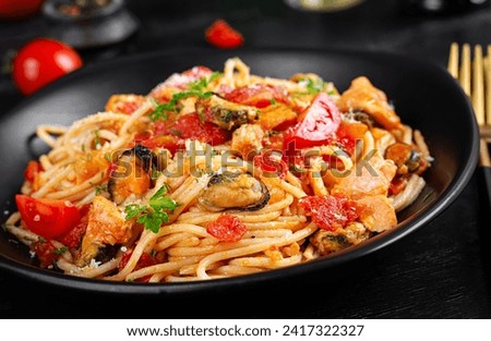 Similar – Image, Stock Photo Traditional pasta with seafood. The chef prepares a pasta marinara. The chef decorates the dish with tweezers. Spaghetti with seafood. Mediterranean Kitchen. People at work. Close-up. Body parts