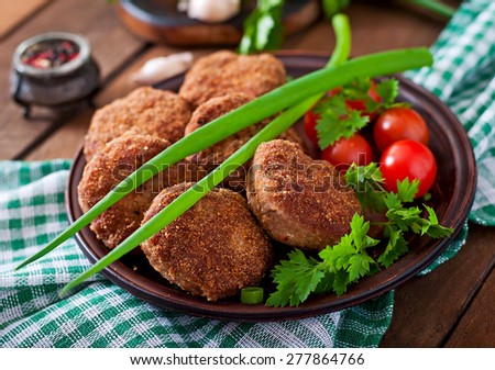 Juicy delicious meat cutlets on a wooden table in a rustic style, Selective focus