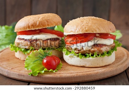 Appetizing hamburger with chicken burger and sauce Tartar