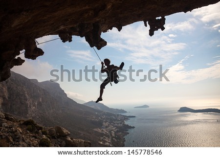 Silhouette of rock climber against sky, Kalymnos Island, Greece
