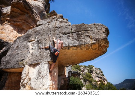 Male rock climber on a cliff
