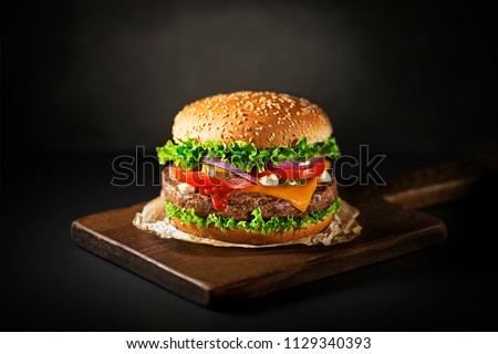 Similar – Foto Bild Leckerer Hamburger mit schwarzem Sesam auf Holztablett