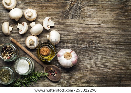 Ingredients with fresh mushrooms on wooden background