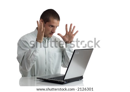 young men angry looking in laptop monitor