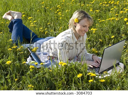 young business women working on laptop outside portrait