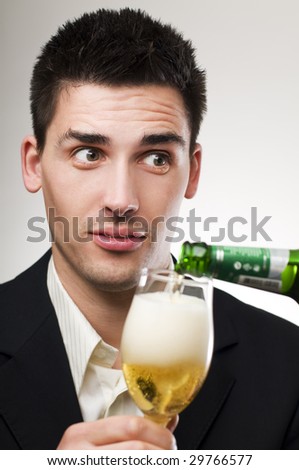 Young handsome men drinking cold beer portrait