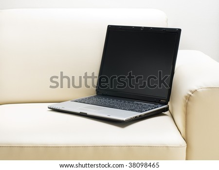 Laptop on a sofa in living room close up