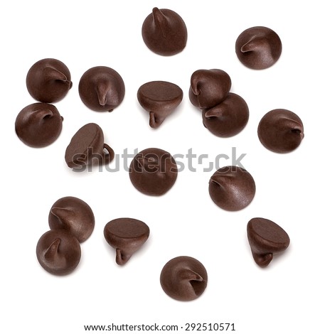 Chocolate morsels spread on white background from top