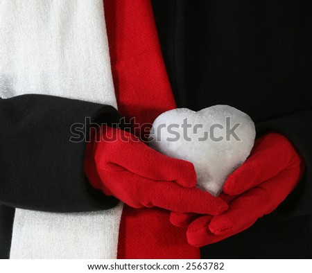Heart made of Snow on Black Coat, Red Gloves and Red and White Scarfs