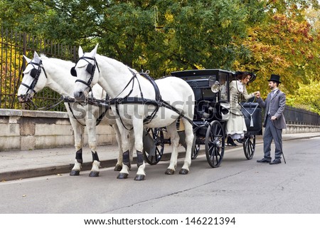 Horse Carriage with old fashioned dressed couple in love