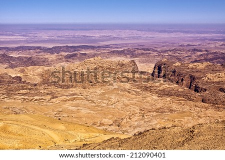 General view of the region of the historic city Petra in Jordan. The canyon at the right is called Al-Siq and leads to Petra, the ancient capital of the Nabateans kingdom - today UNESCO World Heritage