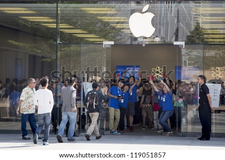 SHENZHEN, CHINA - NOV. 3:  Customers walking into the new Apple store. Apple open its seventh Apple store in mainland China, located in SHENZHEN, November 3, 2012.