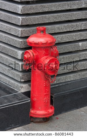Red fire hydrant with Chinese letters \