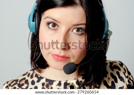 Girl in headset for remote consultation and receiving applications.
