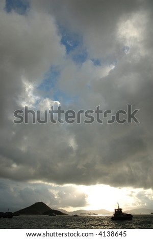 Sunset with cumulus clouds in blue sky