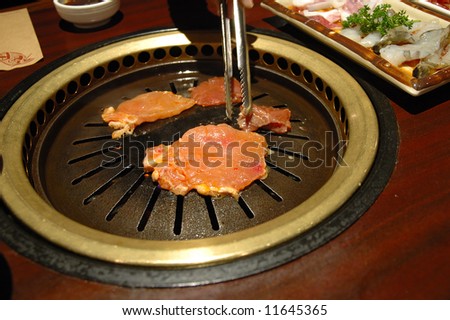 Korean barbecue - meat are being cooked on korean stove