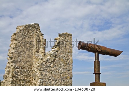 Rustic telescope and ancient ruins
