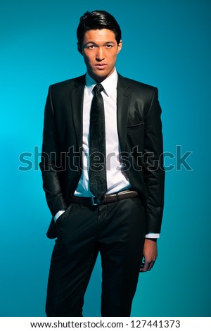 Handsome asian man in suit. Summer fashion. Studio shot.