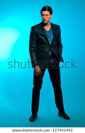 Handsome asian man in suit. Summer fashion. Studio shot.