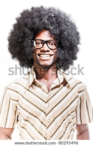 Studio portrait of cool black young man with black glasses, striped retro 70s shirt and retro afro hair isolated on white background.