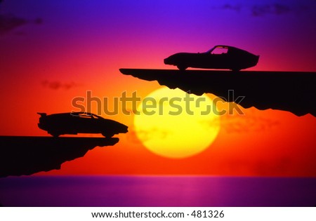 Sunset and cars on cliff