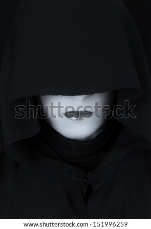 Woman in black cape with sad face and red lips portrait artistic conversion