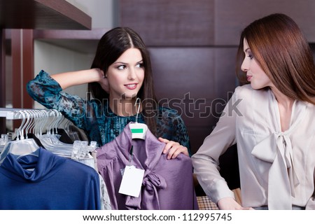 Friends give pieces of advice to each other concerning the clothes