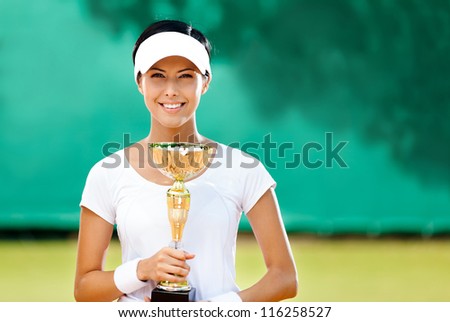 Tennis player won the cup at the sport contest. Prize