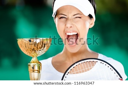 Tennis player won the cup at the sport tournament. Victory