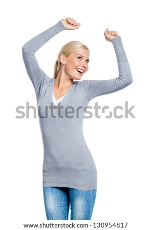 Half-length portrait of female with her fists up, isolated on white. Sign of happiness and success