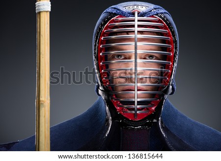 Portrait of kendo fighter with shinai. Concept of Japanese martial arts