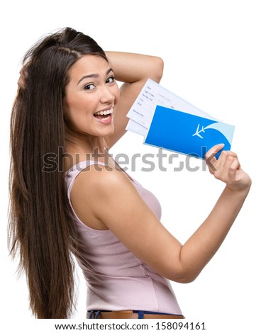 Half-length portrait of female tourist handing airline ticket, isolated on white