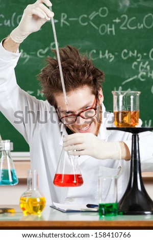 Mad professor conducts some chemical tests in his laboratory
