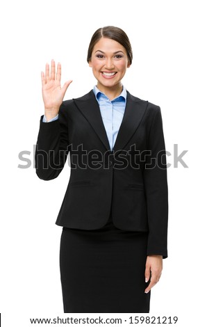 Half-length portrait of businesswoman waving hand, isolated on white. Concept of leadership and success